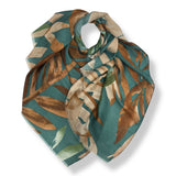 Green and brown patterned scarf on a white background